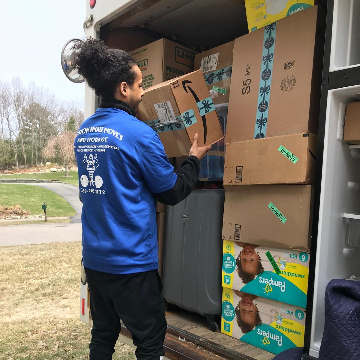 Boston Small Moves crew member loading moving boxes